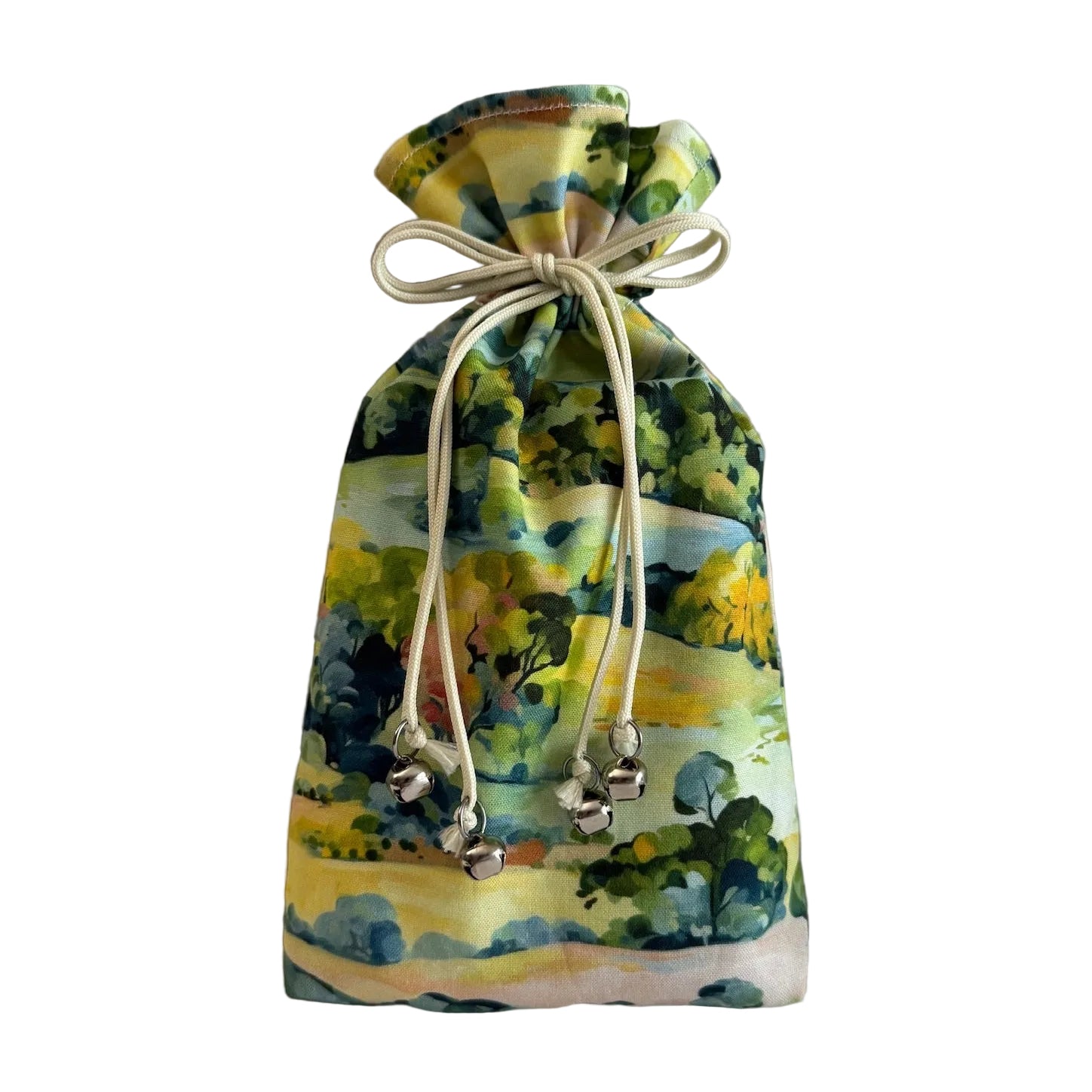 Drawstring bag made with a bright fabric that shows a countryside scene