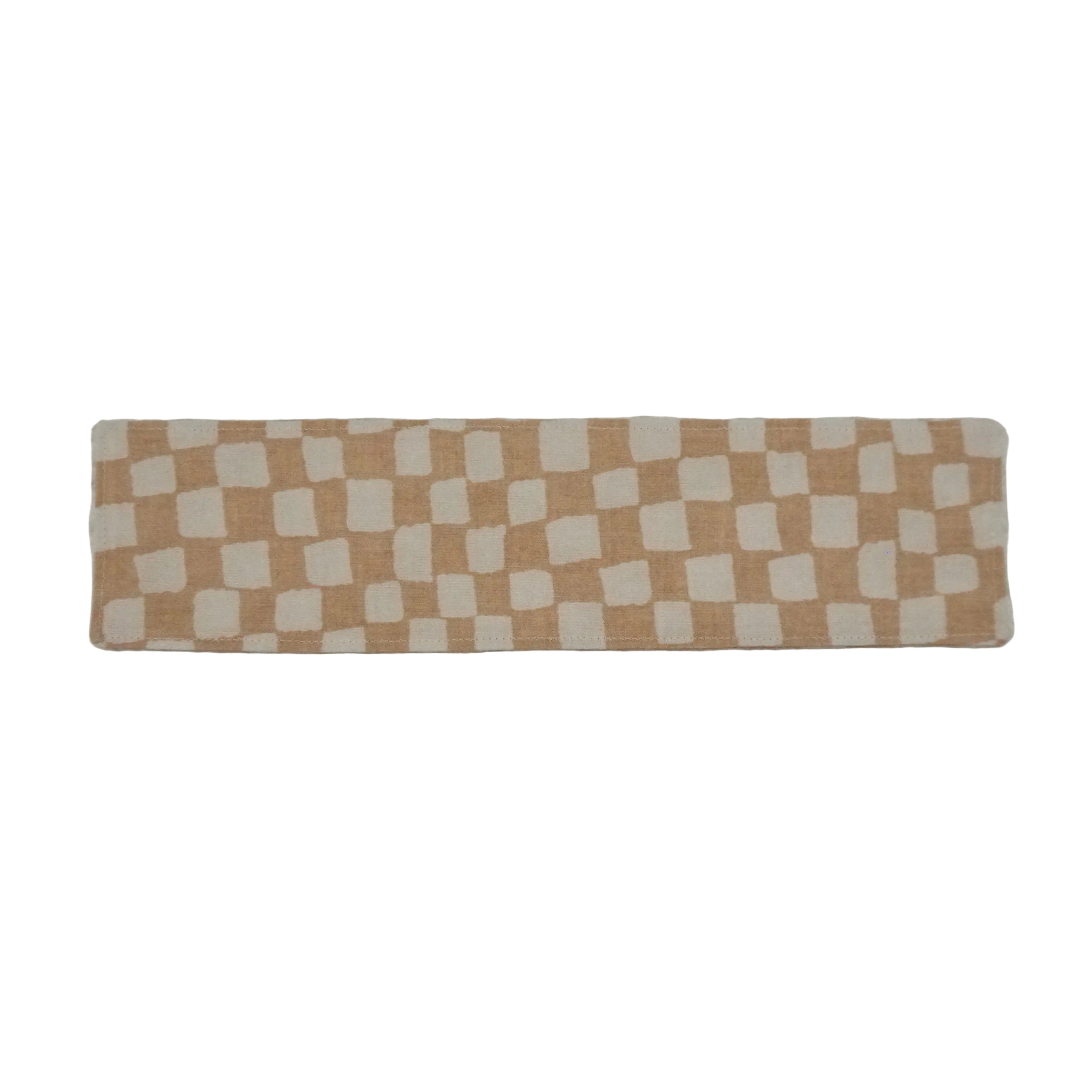 Bookmark with beige and white checkerboard pattern on a white background.
