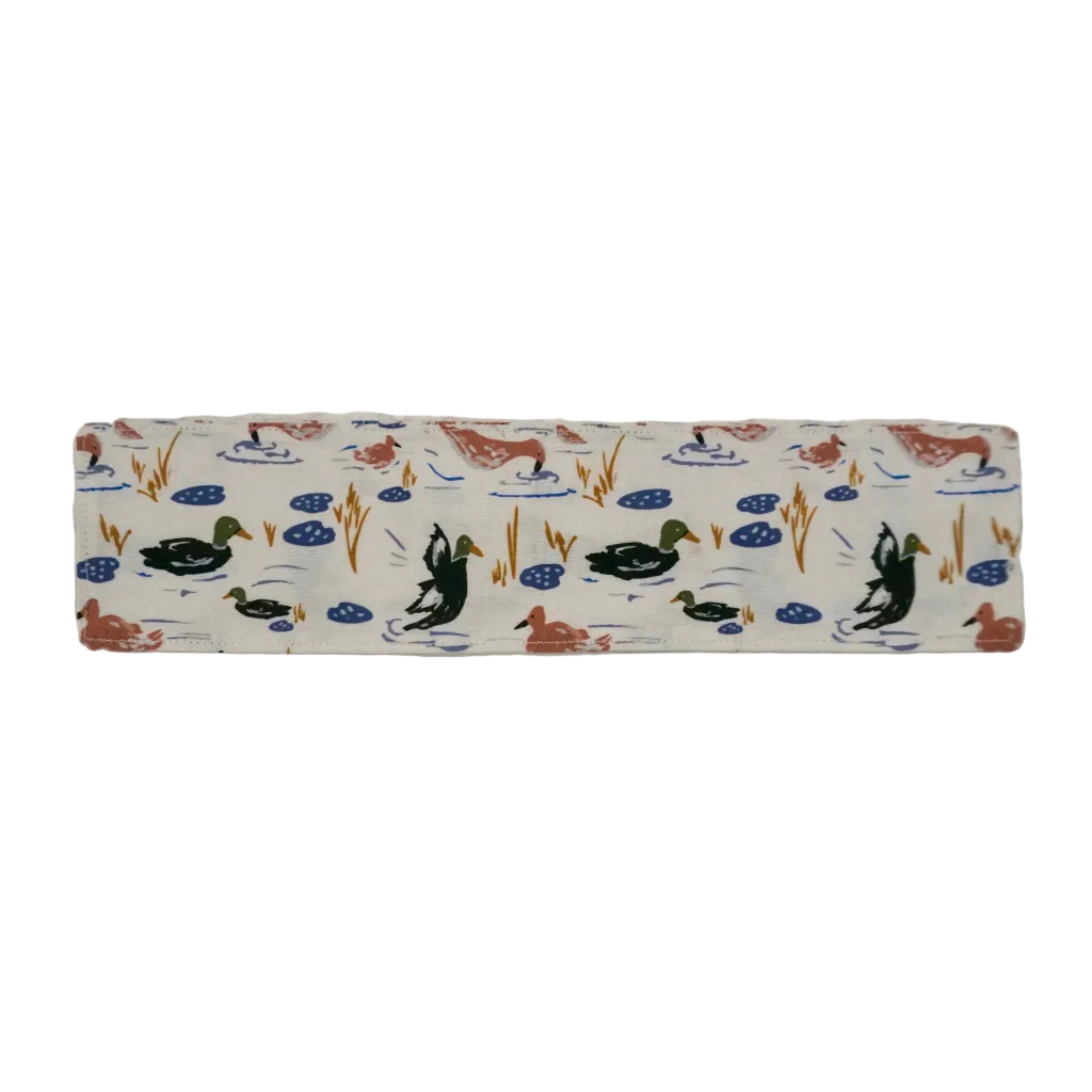 Off-white fabric bookmark with a salmon, royal blue, gold, and forest green duck and lilly pad pattern on a white background. 