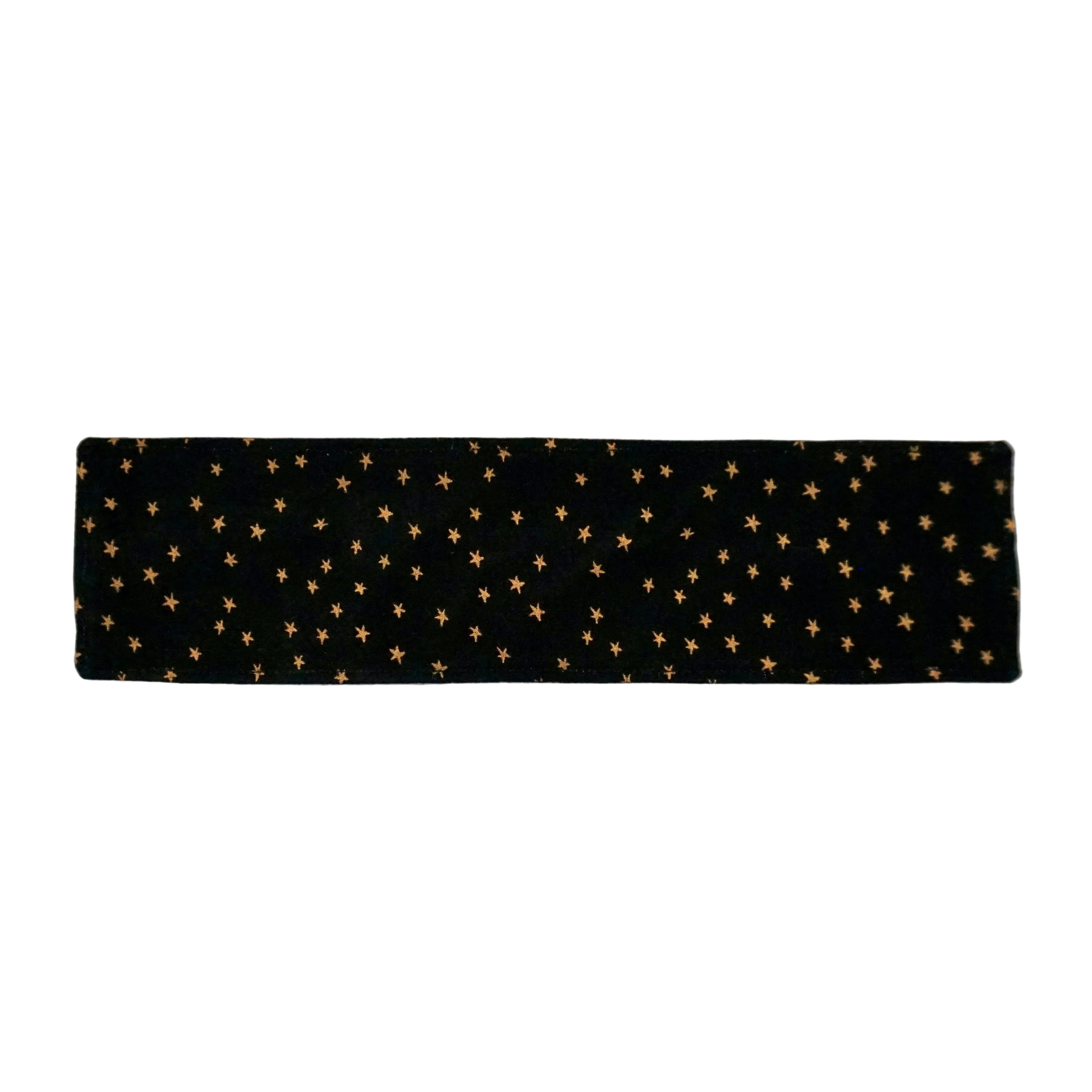 Black fabric bookmark with shimmery gold star pattern on a white background.