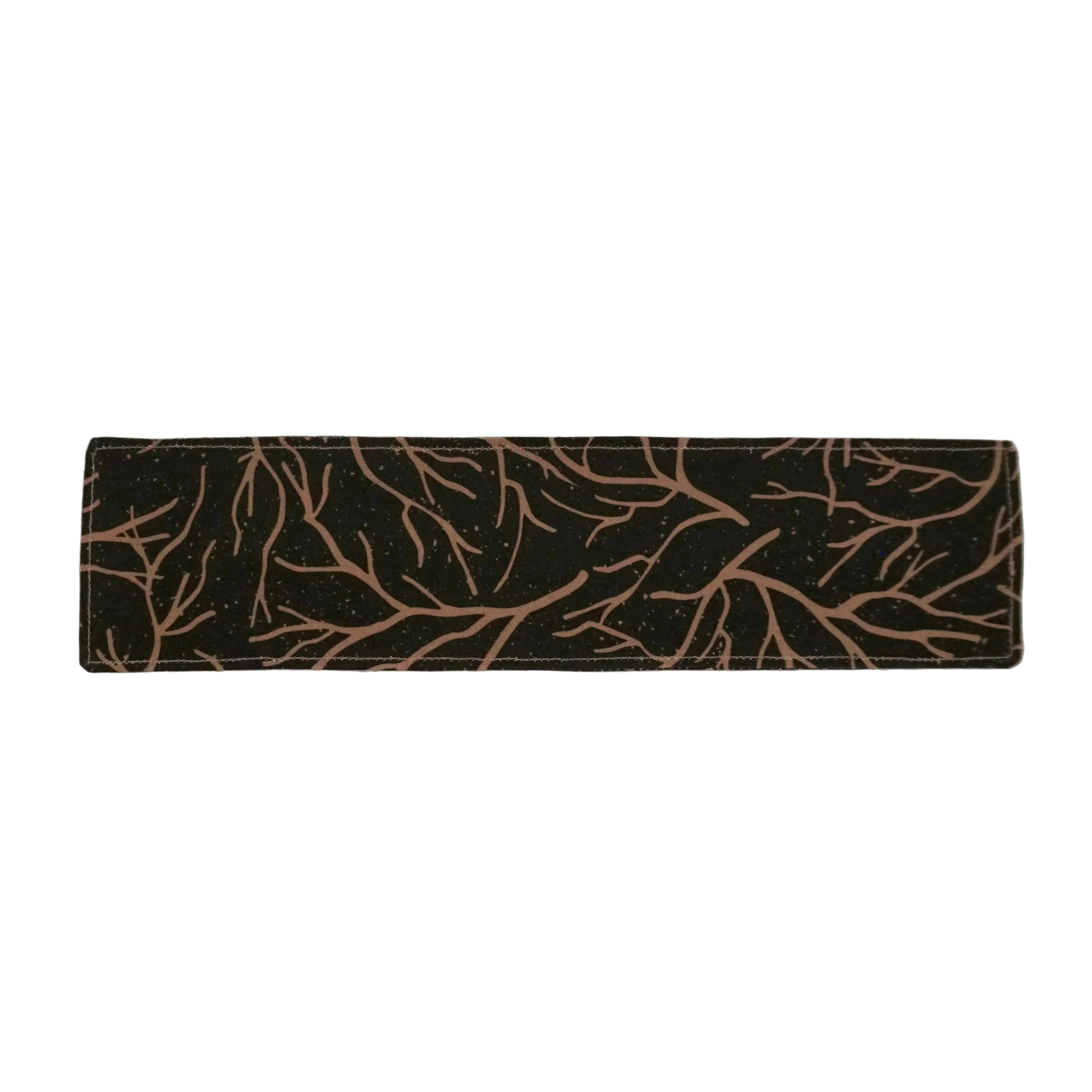 Charcoal gray bookmark with beige branch pattern on a white background.