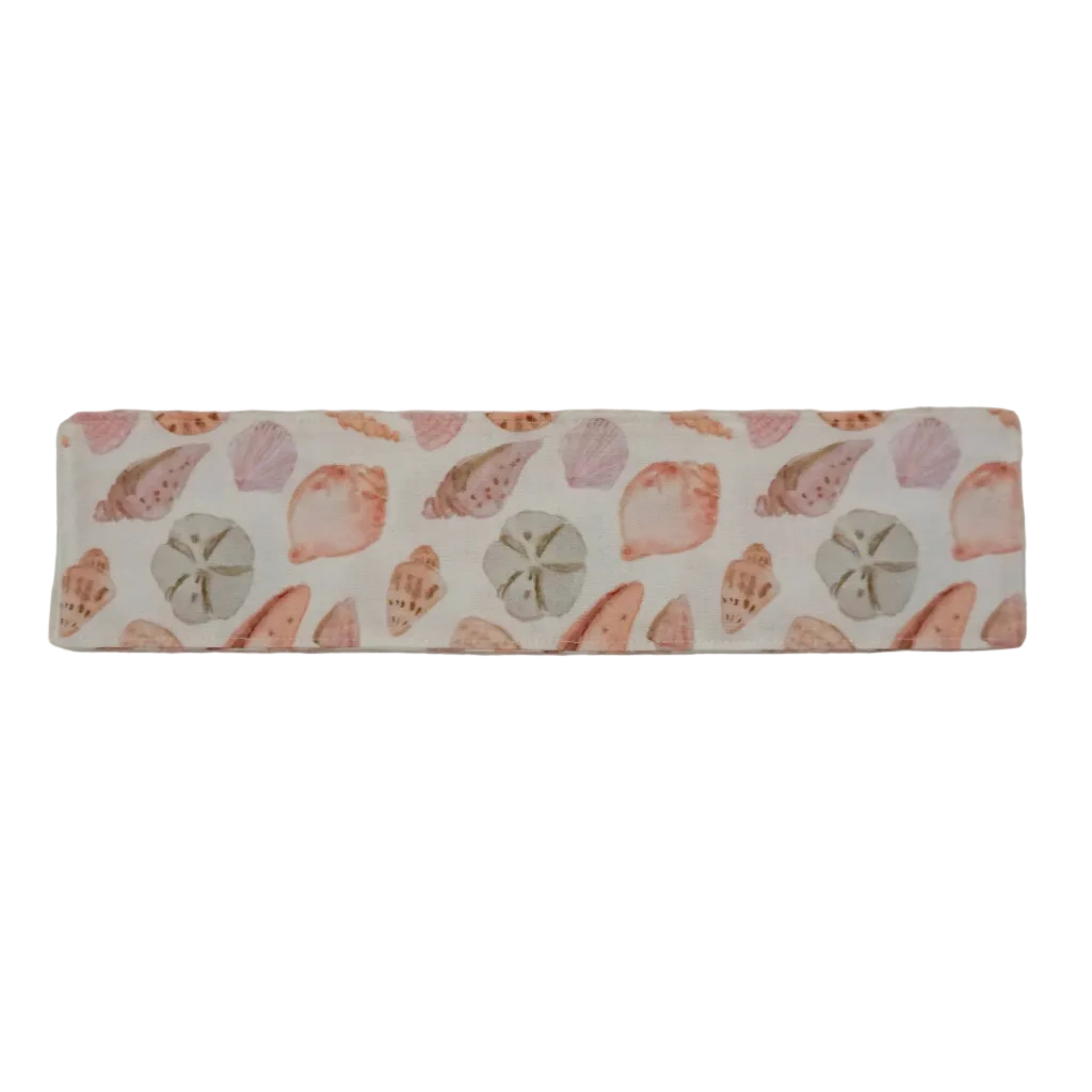 Off-white fabric bookmark with a pink seashell pattern on a white background.