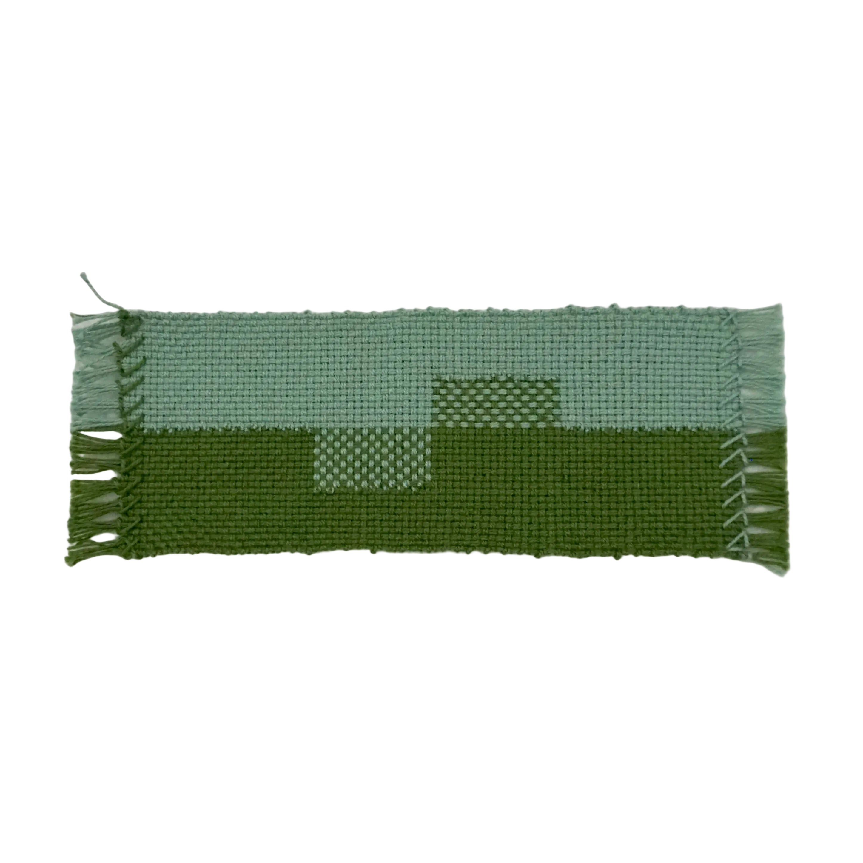 Blue and green woven bookmark with rectangle pattern on a white background.